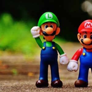 Macro Photography of Mario and Luigi Plastic Toy
