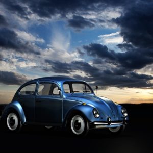 Blue Volkswagen Beetle Under Blue Sky and White Clouds during Golden Hour