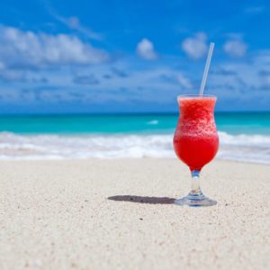 Red Slush Drink in Glass on Beach