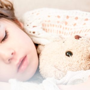 Girl Sleeping With Her Brown Plush Toy