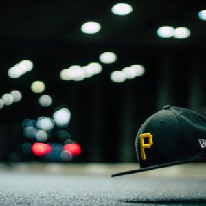 Black and Yellow P Cap Hanging in the Air