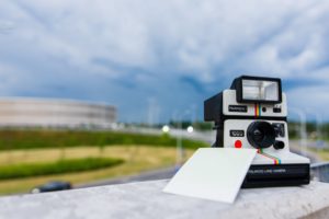 Black and White Polaroid Instant Camera With Photo Paper