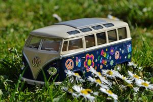 Volkswagen Beige and Blue Van Scale Model Near White Daisy Flower