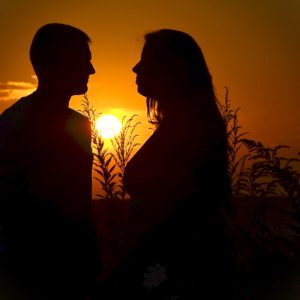 Silhouette of Man and Woman during Sunset