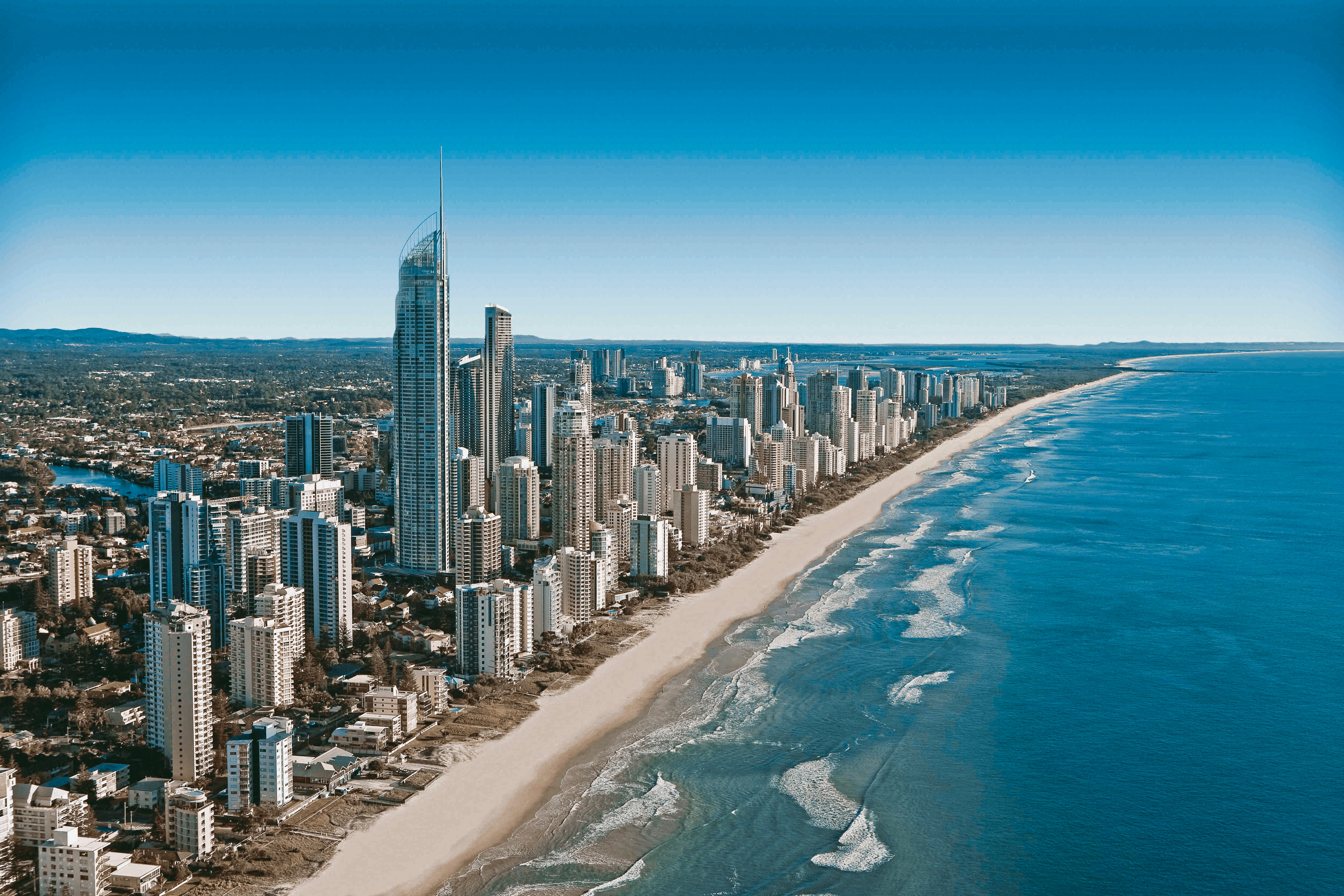 A long sandy coast with high-rises and skyscrapers