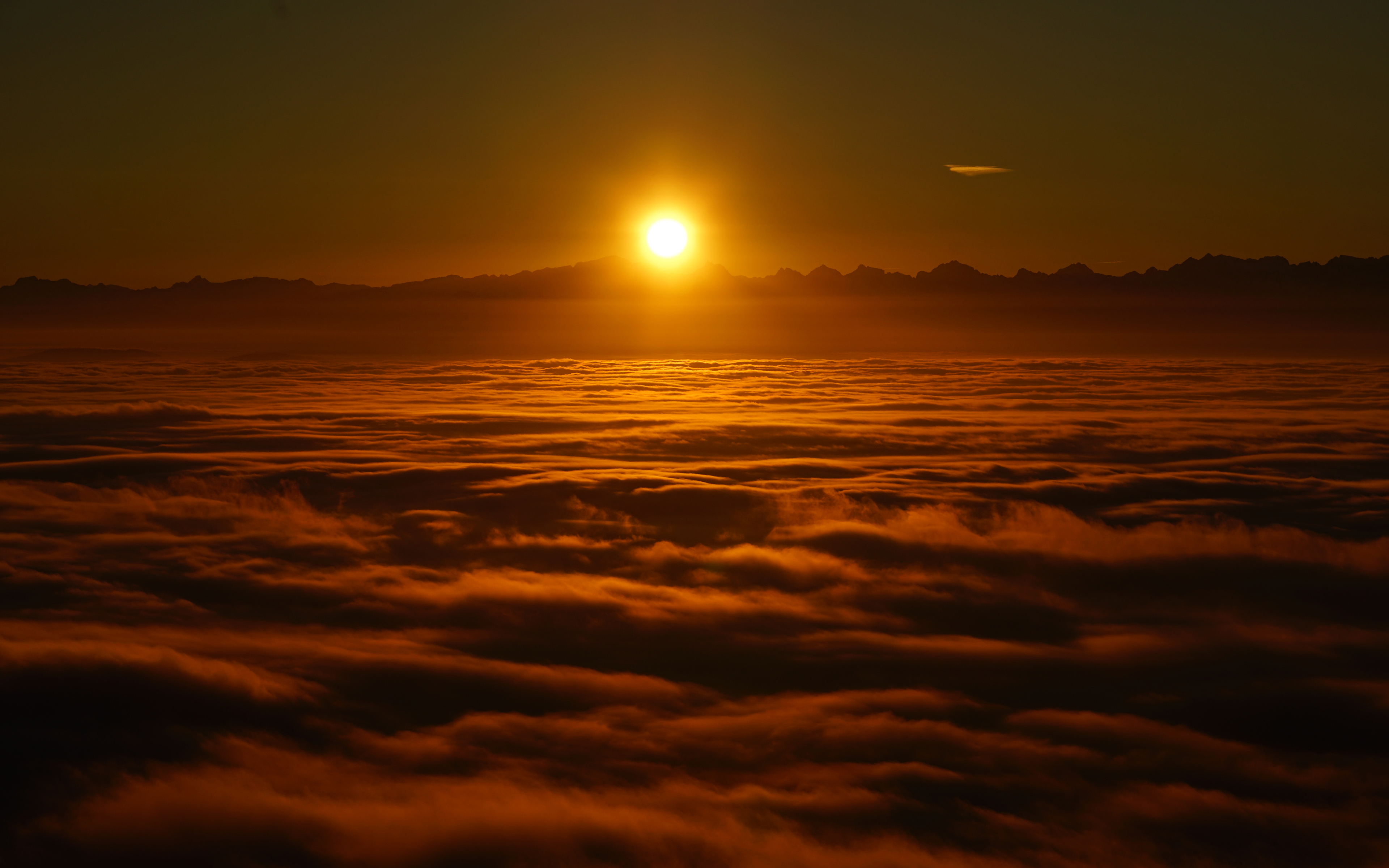 Sunrise above Clouds 4K Wallpapers