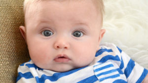 Cute Little Baby Is Staring At The Camera Wearing White And Blue Striped Tshirt HD Cute