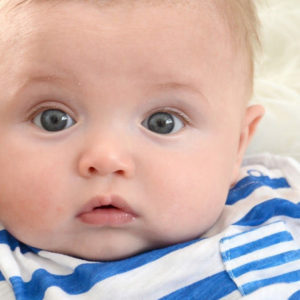 Cute Little Baby Is Staring At The Camera Wearing White And Blue Striped Tshirt HD Cute