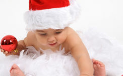 Cute Baby Is Wearing Santa Claus Cap Having Christmas Decoration Red Ball In Hand HD Cute