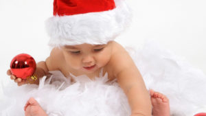 Cute Baby Is Wearing Santa Claus Cap Having Christmas Decoration Red Ball In Hand HD Cute