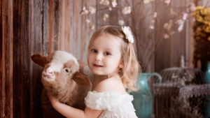 Cute Little Girl Is Wearing White Dress Playing With Calf HD Cute