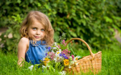 Cute Little Girl With Flower Basket Wearing Blue Dress In Green Leaves Background 4K HD Cute