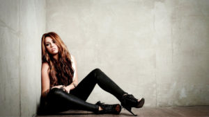 Blonde Hair Miley Cyrus Is Sitting On Floor And Leaning Back On Wall HD Miley Cyrus