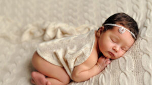 newborn child baby is sleeping on woolen knitted cloth in blur background hd cute Wallpapers