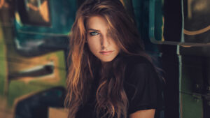 Stunning Nice Beautiful Girl Model Pose Blur Colorful Background Look Black Dress HD Girls Wallpapers